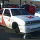Wheel Falls Off Racing I-Mark, Symbolizes Isuzu's American Experience